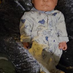 lovely looking weighted doll, maybe a reborn doll, neutral features so can dress as boy or girl. does connect to magnetic dummy which we have located