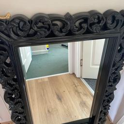 Beautiful black carved mirror, excellent condition, 25 x 36 inches.,