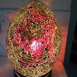 Egg shaped 
Glittery Table Bedside Lamp
with built in lamp
detachable base for change of bulb etc
Hand operation switch
Pretty n cheerful colours
Has christmasy fee to it
Good for party or entertainment
Excellent condition inspiring damage pr cracks
Fully tested and working
Around 9" tall from base to peak of lamp
Sold as seen
No refund or exchange
Collection or postage extra
Cash on collection