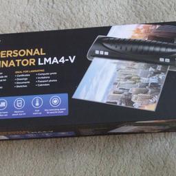 unopened laminator which includes a starter kit