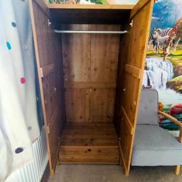 solid wood wardrobe, the back paneling could do with securing a bit better but other then that the wardrobe is solid and in good condition, collection only