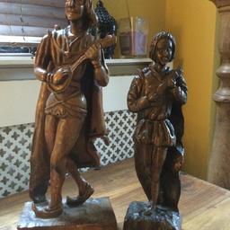 Two old carved wooden minstrel figures. Large is approximately 50cm tall, smaller one is approximately 40cm tall. Excellent condition. Collection only please.