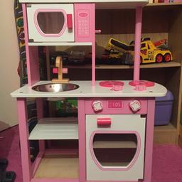 Kids pink wooden kitchen.
Comes with wooden and plastic accessories.
Pen mark on a tray (see picture).

Collection only.