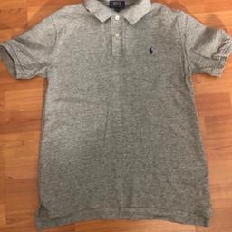 Ralph Lauren Polo top 
size 14/16 (L/G)
grey 
navy logo polo 
2 buttons 
short sleeve 

**ALSO LISTED ON OTHER SITES**