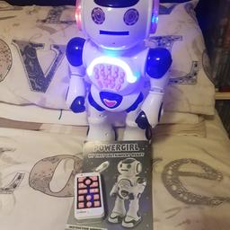 Powergirl remote controlled robot, talks, dances, tells silly jokes and shoots foam disks. Never been played with. Excellent condition as new. Comes with instruction manual