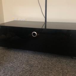 Black Gloss Tv stand with storage and glass shelves . Mint condition no scratches only used for a few months
