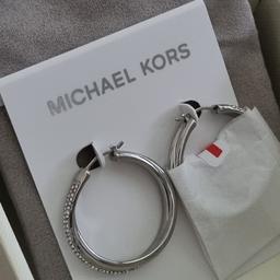 brand new, in MK box with pouch and care card
silver with stone detailing
retailing at £89