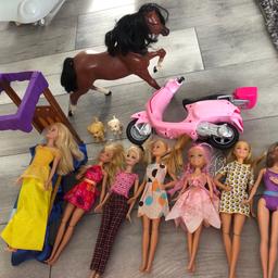 Barbie bundle 
7 dolls
1 bed
1 Barbie scooter
2x barbie dogs