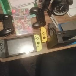 Very good condition, comes with joy cons, charger, dock and mario kart deluxe game, can post plus collection from Halifax