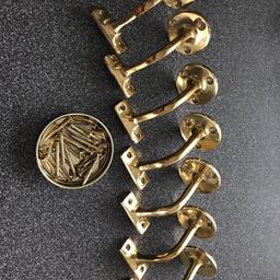 Seven staircase handrail brackets. 
Polished brass with brass screws. 
Used but good condition. 
Collection only