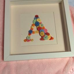 picture frame with handmade A out of buttons. freestanding or can be hung
