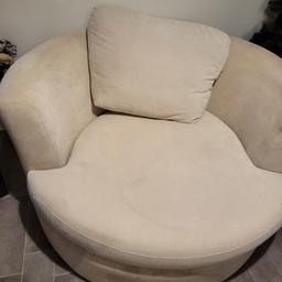 cream swivel chair 52 inch.will need cleaning as its been in storage