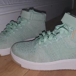 brand new with no box. bought last year and have never been worn. mint green with slight gold shimmer. size 4 high-rise