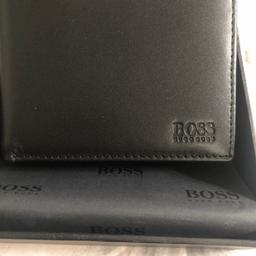 Brand new in used Hugo Boss wallet with built in coin holder, card etc
Small indentation on the box 
Perfect Xmas gift