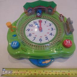A Thomas the Tank Engine toy by TOMY that helps kids learn to tell the time. 
Battery powered,  batteries included.. 
Use the buttons to set the time when asked to by the Fat Controller and watch Thomas the Tank Engine move around the track to check if you get the time right. 
A few slight scuffs on the game,  works perfectly. no Box. measures approx 22cm by 22cm.
Collection only from postcode B60
