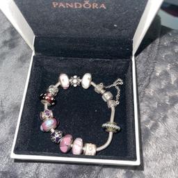 Pandora bracelet with 13 charms worth over £300