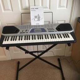 Keyboard with stand in original box, very good condition