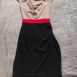 Never worn but no tags - block colour dress in black and beige with a cowl neck and a red belt.