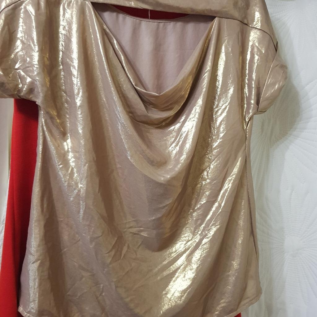 dorothy perkins gold colour top with cut out at back .large size 10 would prob fit 12 . collect alfreton