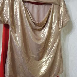 dorothy perkins gold colour top with cut out at back .large size 10 would prob fit 12 . collect alfreton