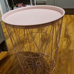in really good condition pink table top comes off to put your thows our bits in.