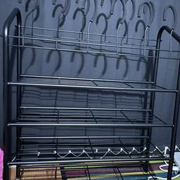 Shoe rack with boot hooks on top,