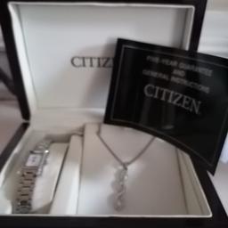 Citizen ladies watch, with necklace in mahogany polished box. Never been worn never been out of the box. Needs new battery.