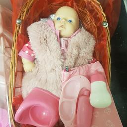 Small baby doll with plate,bottle, potty cream.