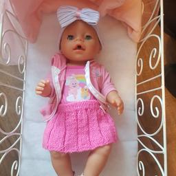 Baby born doll with a metal fold away cot comes with blankets,  baby born potty and baby born dummy.