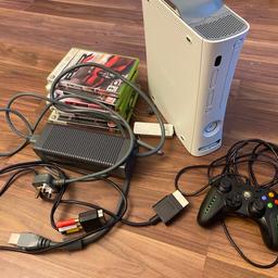 In excellent condition, works perfect as can be seen in the pictures. 
Comes with a pad, all the cables, wireless adapter and a selection of games. 

Collection only S74