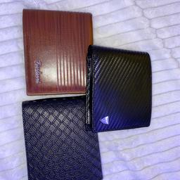 three wallets 
(i don't know the brands) 
no tags but never been used