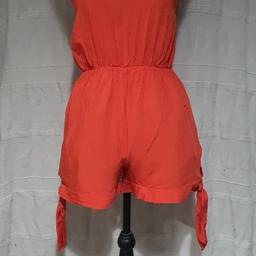 Halter neck playsuit, thin material size says xl but it comes up small. Seam around bum is looser than the rest as in pics but not noticeable when wearing.
