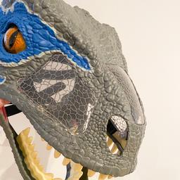 Jurassic World chomp and roar mask of Blue the Velociraptor. Makes different dinosaur noises when you open your mouth inside the mask. Hardly used like new. 

Collection Only S74