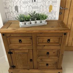 Mexican pine sideboard with 4 drawers and 1 cupboard with shelf. Black metal handles. 44 cm d. 92 cm w. 84 cm h. Good condition. Cash on collection only