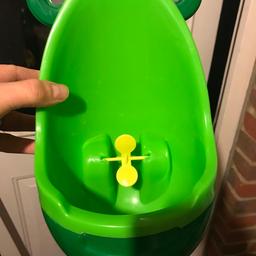 Toddler urinal for training boys to stand whilst urinating.
