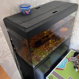 Fluval fish tank with stand comes with heater pump and light.
