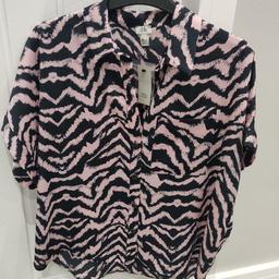 Brand new with tag, ladies River Island top size 10. Pink and black. Button fastening. Original cost £30. From a smoke free and pet free home. Collection Wallasey CH45 or will post for additional cost. PayPal accepted.