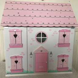 Immaculate 3-level wooden dolls house with wooden furniture.