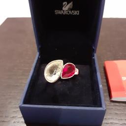 Swarovski medium size ring with original box.  Excellent condition.