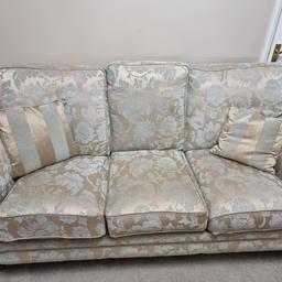 Beautiful 3 piece suite cream and duck egg in good condition. Comes with arm covers and cushions. Steam clean only. Wooden legs with brass wheels. One wheel on the chair needs attention. Cost £4400 new in clean condition but will need cleaning before long. No stains that I can see, no tears etc. Stunning chic set. One, two and 3 seater. Any question then please message. Must be collected. Please note that it's for sale in other places and listing will be removed at anytime if its sold elsewhere.
