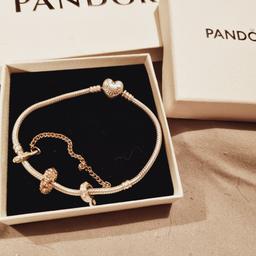 original pandora bracelet 

large with charm and safety chain charm 

no longer worn due to having two new ones for Xmas 

comes with box and bag 

£30 open to offers for quick sale