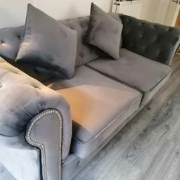 Grey
 2 seater
Chesterfield
Slive legs
Brand new use sat on twice comfortably seats going for cheap as need something bigger for house so will except £200 as I final offer was expensive and looks expensive good quality sofa. Collect or you can arrange your own delivery transport at your own cost.