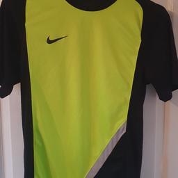 Nike Dri-fit running top not great condition has a few stains as seen in pics and a pull in the back hence price from smoke and pet free home.