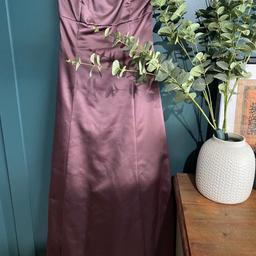 In excellent condition, DEBUT Size 10 from Debenhams Opera Mauve Satin Strapless Lined Ball Gown which is longer at the back due to a folded train coming from the waist than the front. The bodice is boned to give support. There is a concealed side seam zip. The skirt has an extra black net underskirt to give fullness. Very elegant dress that could be worn year round to any special event, even as a bridesmaids dress.underarm to underarm 32”/ waist 31” , underarm to hem down the front 46.25”
