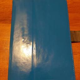 Amazon fire cover/ universal tablet cover to fit most tablets up to 5 1/2" x 9" ,blue leather look,used but still in very good condition , can post for extra fee.