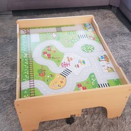 wooden train table set.
the top scene can be turned over to reveal another scene.
there is a drawer that slides underneath the table for storage. there is also extra track and foliage.
collection kirkby in ashfield
