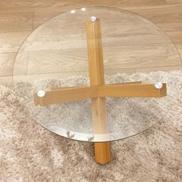 Lovely glass topped oak legs Coffee Table. Slight scratches to glass. This item is heavy. Possible collection from Holbeach. 