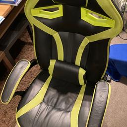 Gaming chair. Some of the leather has cracked on arm and sest but still great condition.