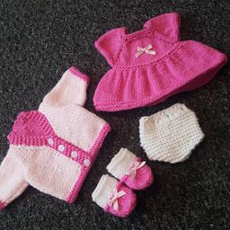 hand made dolly clothing set
cute little dress with matching bootees
pair of knickers
and a cardigan 
fit 12inch baby doll
all made from new yarn in a smoke free home
collect or post