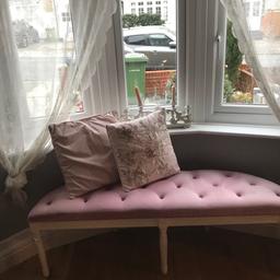 Pink buttoned seat with white wooden legs,fits nicely in most bay sizes,few tiny marks not really noticeable on seat and legs may need bit of paint so sold as seen.cushions not included as still using them.the bench can also be used for dressing table seat or piano seat?